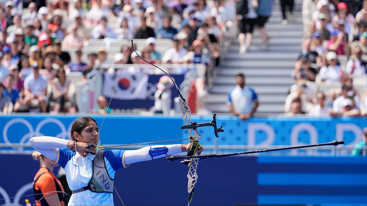 (AP Photo/Rebecca Blackwell) : India's Bhajan Kaur shoots during the women's team quarterfinals competition between the Netherlands at the 2024 Summer Olympics, Sunday, July 28, 2024, in Paris, France. 